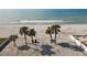 Aerial shot of a pristine beach with palm trees and inviting turquoise waters at 115 16Th St, Belleair Beach, FL 33786