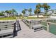 Picturesque dock offering serene waterfront access with seating areas at 115 16Th St, Belleair Beach, FL 33786