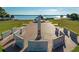 Overhead view of a veteran's memorial with stone monuments and a peaceful waterfront backdrop, honoring service at 116 Shore Drive Pl, Oldsmar, FL 34677