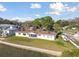 Waterfront home with a well-maintained lawn and sea wall, offering direct access to the water and scenic views at 116 Shore Drive Pl, Oldsmar, FL 34677
