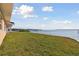 Well maintained lawn leading to a seawall along the waterfront at 116 Shore Drive Pl, Oldsmar, FL 34677