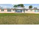 Aerial view of home with well maintained lawn and waterfront at 116 Shore Drive Pl, Oldsmar, FL 34677