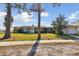 Charming single-story home with a well-manicured lawn, a welcoming entrance, and an attached garage at 116 Shore Drive Pl, Oldsmar, FL 34677