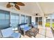 Screened in patio with view of water. Patio set with three chairs and a table at 116 Shore Drive Pl, Oldsmar, FL 34677