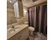 Standard bathroom with tile flooring, toilet, sink, and combination shower and tub with striped curtain at 12760 Indian Rocks Rd # 540, Largo, FL 33774