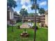 View of the community pool and recreational area, surrounded by palm trees at 12760 Indian Rocks Rd # 540, Largo, FL 33774