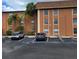 View of the building with two cars parked in the parking lot at 12760 Indian Rocks Rd # 540, Largo, FL 33774