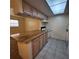 Kitchen featuring a breakfast bar, white appliances, and an open view to the living area at 12760 Indian Rocks Rd # 540, Largo, FL 33774