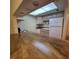 Bright kitchen featuring a skylight, ample counter space, and white appliances at 12760 Indian Rocks Rd # 540, Largo, FL 33774