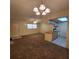 View of the living room and kitchen, offering an open floor plan with plenty of natural light at 12760 Indian Rocks Rd # 540, Largo, FL 33774