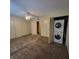 Bedroom with carpeting, ceiling fan, closet, and stackable washer and dryer at 12760 Indian Rocks Rd # 540, Largo, FL 33774