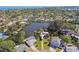 Aerial view of homes with waterfront access, surrounded by lush greenery and clear blue waters at 1516 Massachusetts Ne Ave, St Petersburg, FL 33703