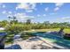 An outdoor shuffleboard court and lounge chair offer entertaining opportunities in the backyard of this waterfront home at 1516 Massachusetts Ne Ave, St Petersburg, FL 33703
