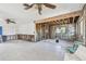 Renovated living room with exposed beams, updated windows, and a clean, modern design at 1516 Massachusetts Ne Ave, St Petersburg, FL 33703