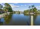 Scenic waterfront view featuring a serene body of water surrounded by lush tropical vegetation at 1516 Massachusetts Ne Ave, St Petersburg, FL 33703