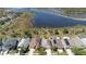 Aerial view of homes near a lake showcasing community and natural surroundings at 1705 Bonita Bluff Ct, Ruskin, FL 33570