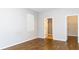 Bright bedroom with wood floors and view to bathroom and walk-in closet at 1705 Bonita Bluff Ct, Ruskin, FL 33570