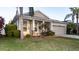 One-story home with a manicured front yard, covered porch, two-car garage, and palm trees at 1705 Bonita Bluff Ct, Ruskin, FL 33570