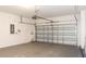 Spacious two-car garage with an automatic door and ample room for vehicles and storage at 1705 Bonita Bluff Ct, Ruskin, FL 33570