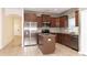 Modern kitchen featuring stainless steel appliances, a central island, and open layout at 1705 Bonita Bluff Ct, Ruskin, FL 33570