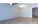 Bright living room offers ample space and tile floors, with a chandelier as a centerpiece at 1705 Bonita Bluff Ct, Ruskin, FL 33570