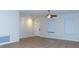 Spacious living room featuring tile flooring, a ceiling fan, and bright natural light at 1705 Bonita Bluff Ct, Ruskin, FL 33570