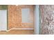 Cozy living room with textured walls and large sliding glass doors leading to the backyard at 1705 Bonita Bluff Ct, Ruskin, FL 33570