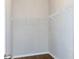 Walk-in closet with wire shelving and wood-look flooring at 1705 Bonita Bluff Ct, Ruskin, FL 33570