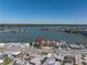 An aerial view highlighting a waterfront property near a bay, situated along a coastal road at 17821 Gulf Blvd # B, Redington Shores, FL 33708