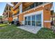 Condo backyard with grass, a patio, a barbeque grill and waterfront views at 17821 Gulf Blvd # B, Redington Shores, FL 33708