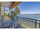 Outdoor balcony featuring a wrought iron table set, waterfront views, and access to the scenic outdoors at 17821 Gulf Blvd # B, Redington Shores, FL 33708