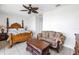 Bedroom featuring a decorative ceiling fan and couch at 17821 Gulf Blvd # B, Redington Shores, FL 33708