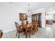 Charming dining room featuring a china cabinet and seating for six, with seamless access to the kitchen at 17821 Gulf Blvd # B, Redington Shores, FL 33708