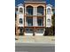 Beautiful three-story townhome featuring balconies and two garage doors at 17821 Gulf Blvd # B, Redington Shores, FL 33708