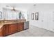 Kitchen with granite countertops, wood cabinets, and stainless steel dishwasher at 17821 Gulf Blvd # B, Redington Shores, FL 33708