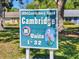 Community sign reading Cambridge Units 1-32, located at 1904 Canterbury Lane with attractive teal and white sign with pelican graphic at 1904 Canterbury Ln # 27, Sun City Center, FL 33573