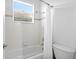 Classic bathroom with white tile, tub, and shower at 20104 Fair Hill Way, Tampa, FL 33647