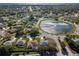 Beautiful aerial view of a neighborhood featuring a scenic lake and lush green landscaping at 26 Clintwood Ave, Englewood, FL 34223