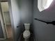 Powder room with modern fixtures and light gray paint at 26 Clintwood Ave, Englewood, FL 34223