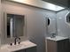 Bathroom with dual sinks, vanities and mirrors offering lots of space at 26 Clintwood Ave, Englewood, FL 34223