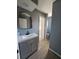 Stylish bathroom featuring a modern vanity, mirror, and sleek fixtures, with updated flooring and neutral paint at 26 Clintwood Ave, Englewood, FL 34223