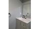 This bathroom showcases a modern vanity with black hardware, bright countertop, and sleek design at 26 Clintwood Ave, Englewood, FL 34223