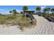 Beach access with stairs leading to the beach and gazebo, enhancing the coastal lifestyle experience at 26 Clintwood Ave, Englewood, FL 34223
