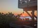 Picturesque view of a sunset over the ocean from the beach at 26 Clintwood Ave, Englewood, FL 34223