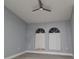 Bright bedroom with sleek floors, complemented by arched windows, creating a calming and inviting space at 26 Clintwood Ave, Englewood, FL 34223