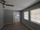 Bedroom featuring neutral walls, windows for natural light, and a ceiling fan at 26 Clintwood Ave, Englewood, FL 34223