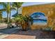 Eye-catching mural of a beach scene adorns the side of a building, adding charm and local flair at 26 Clintwood Ave, Englewood, FL 34223