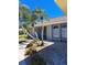 Home with an updated exterior, updated landscaping and rock detail at 26 Clintwood Ave, Englewood, FL 34223