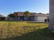 Charming single-story home with a well-manicured lawn and mature landscaping at 26 Clintwood Ave, Englewood, FL 34223