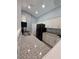 The kitchen features new stainless steel appliances, granite countertops, and white cabinets at 26 Clintwood Ave, Englewood, FL 34223